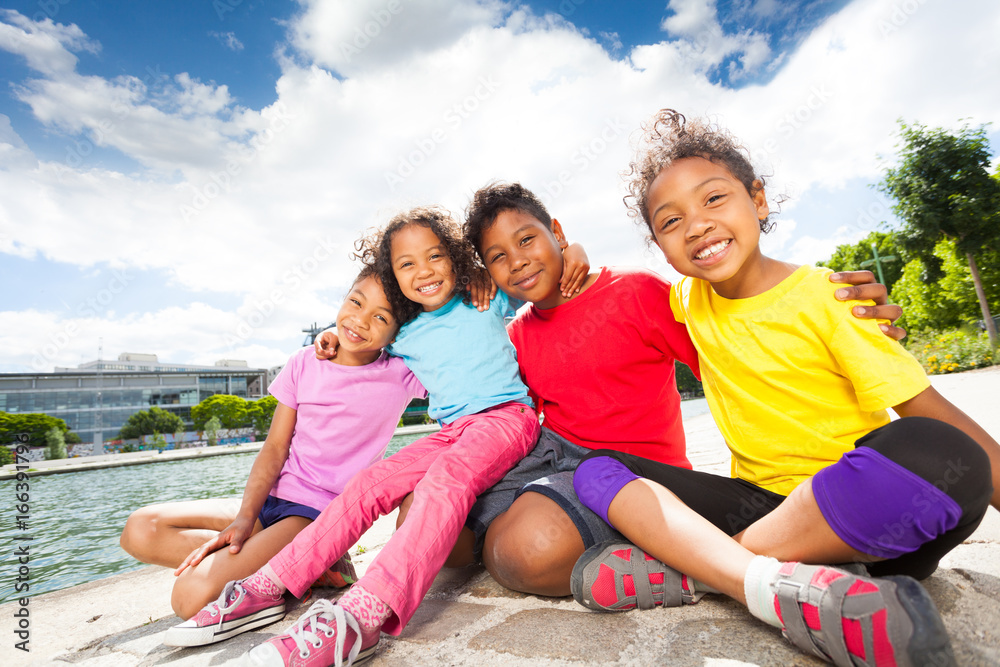 Happy African children spending time by the river