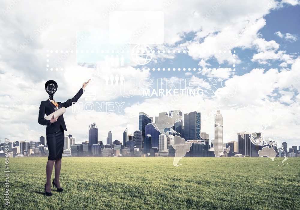 Camera headed woman standing on green grass against modern citys