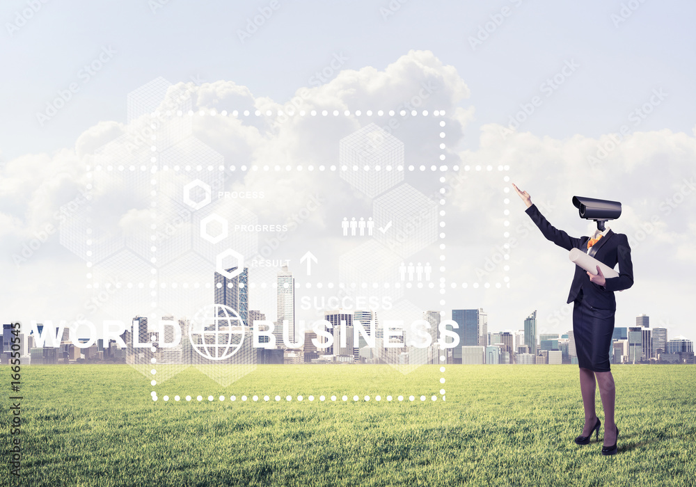 Camera headed woman standing on green grass against modern citys