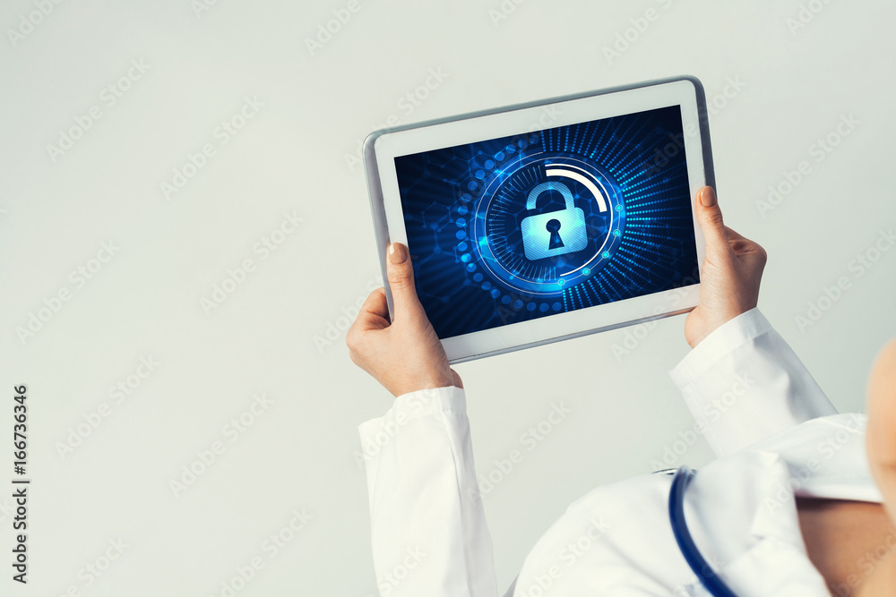 Close of female doctor hands working with tablet pc computer