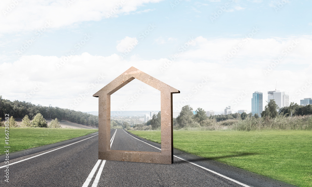 Conceptual background image of concrete home sign on asphalt road