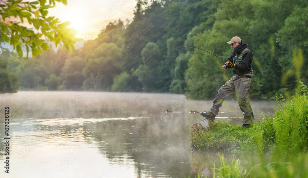 Sport fisherman hunting fish. Outdoor fishing in river