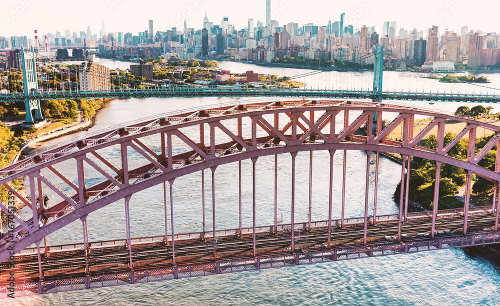 Aerial view of the Hell Gate Bridge over the East River in New York City