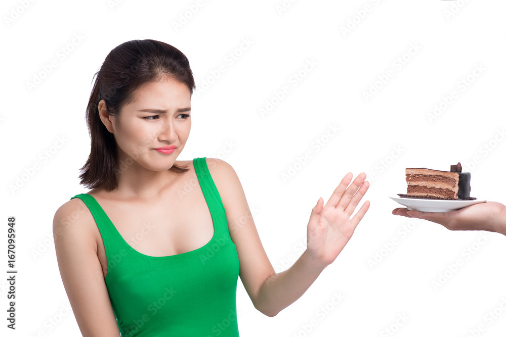 Sad face of asian young woman do not like cake isolated on white background.