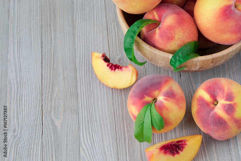 Peaches on wooden background with copy space