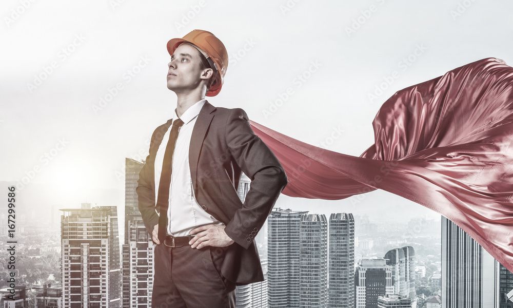 Concept of power and sucess with architect superhero in big city