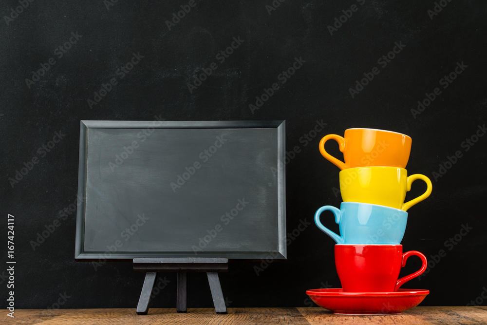 colorful ceramic coffee cups stacked together