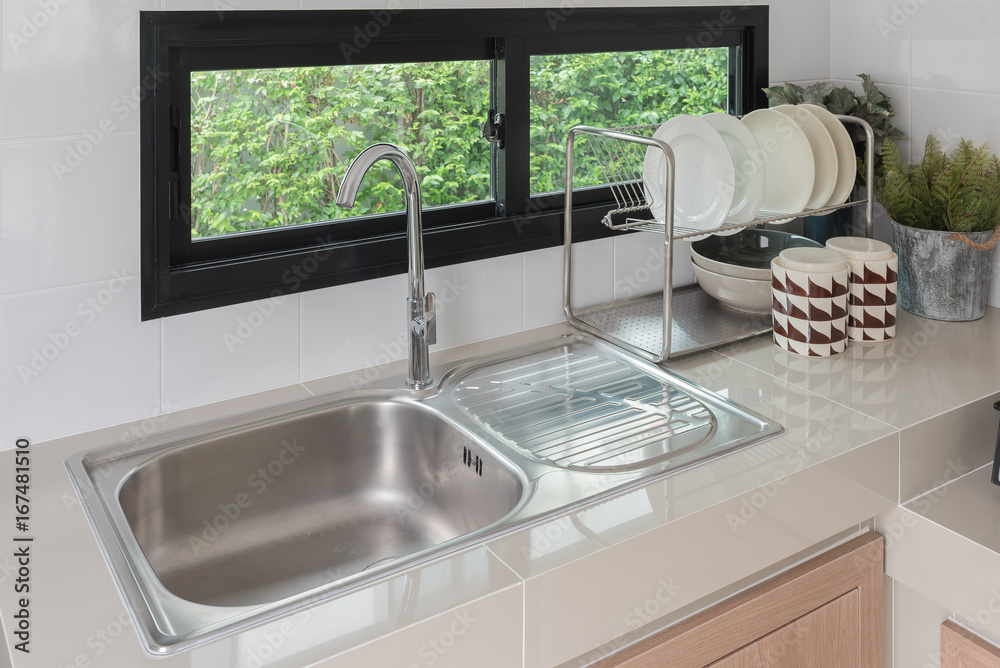 modern kitchen room with sink on counter