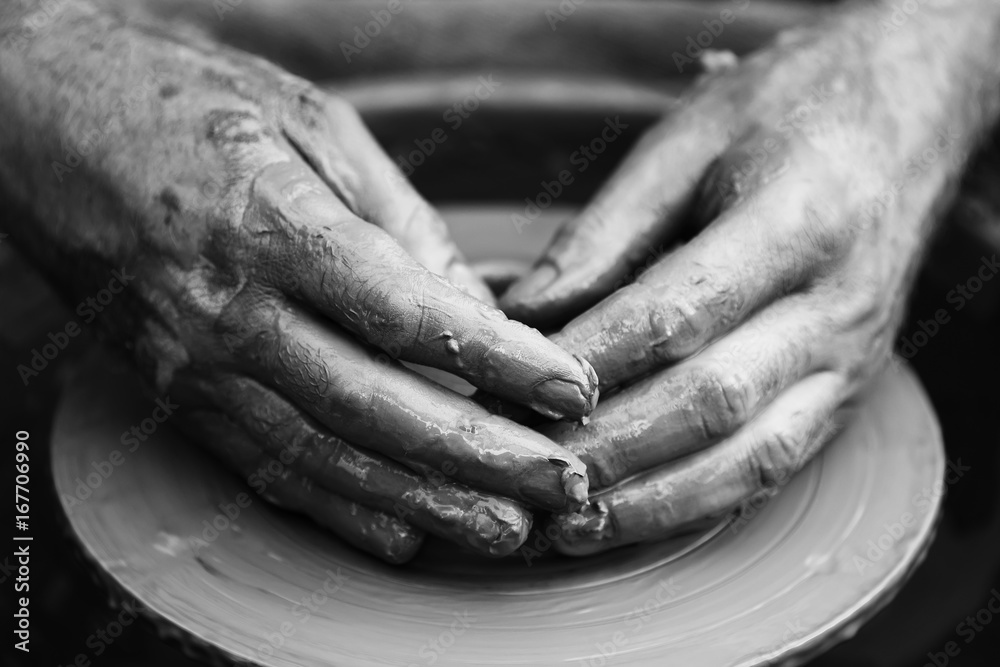 Potter making ceramic pot on the pottery wheel