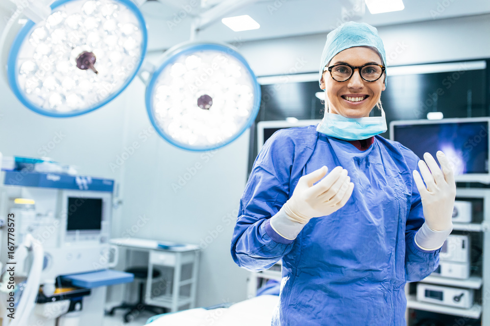 Happy woman surgeon ready for operation