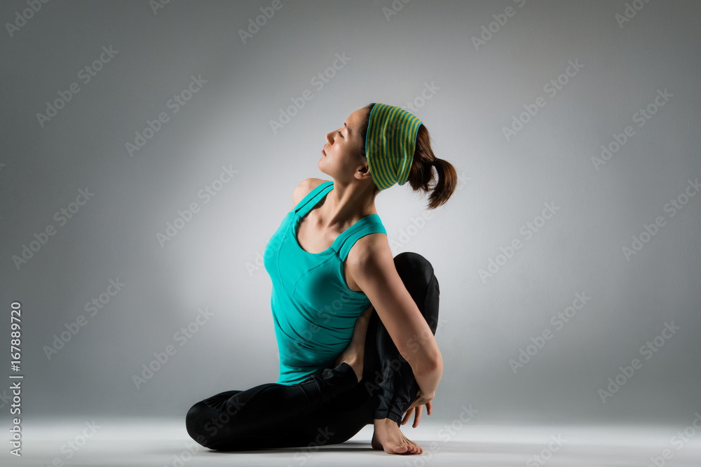 bodybuilding female athlete sitting on floor