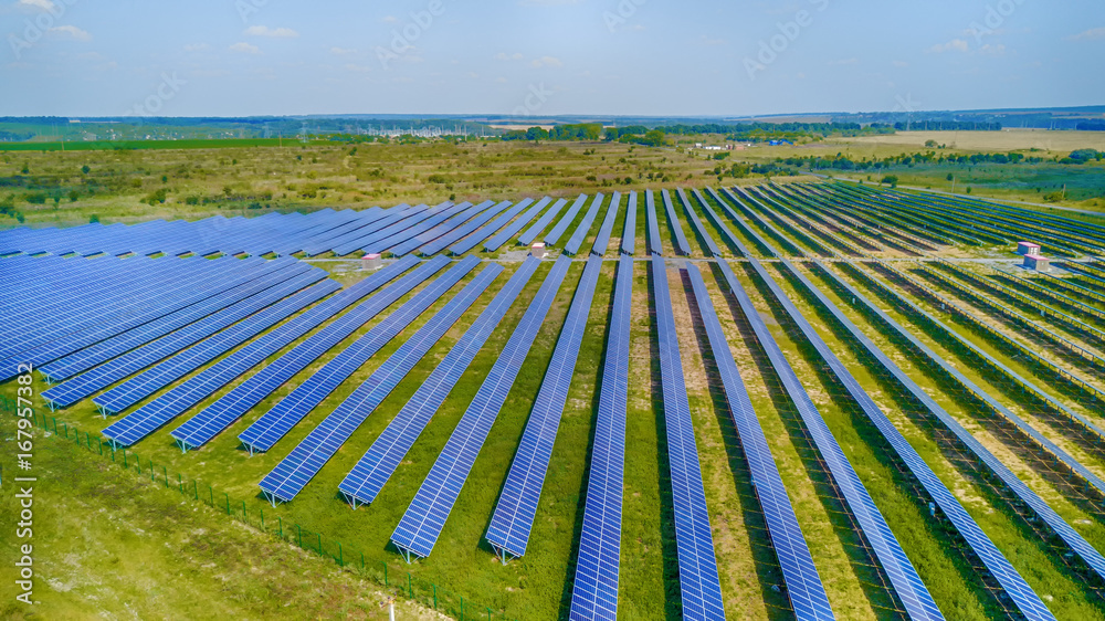 Solar power plant in the field. Aerial view of Solar panels. Solar farm. The source of ecological re