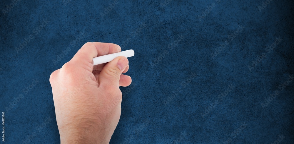 Composite image of business man writing with chalk