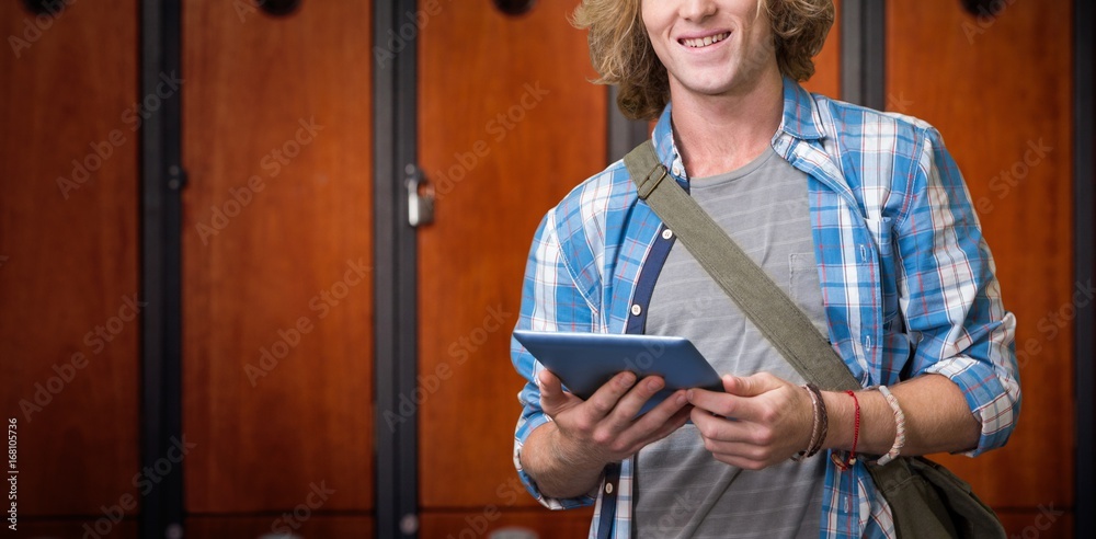 Composite image of student using tablet in library 