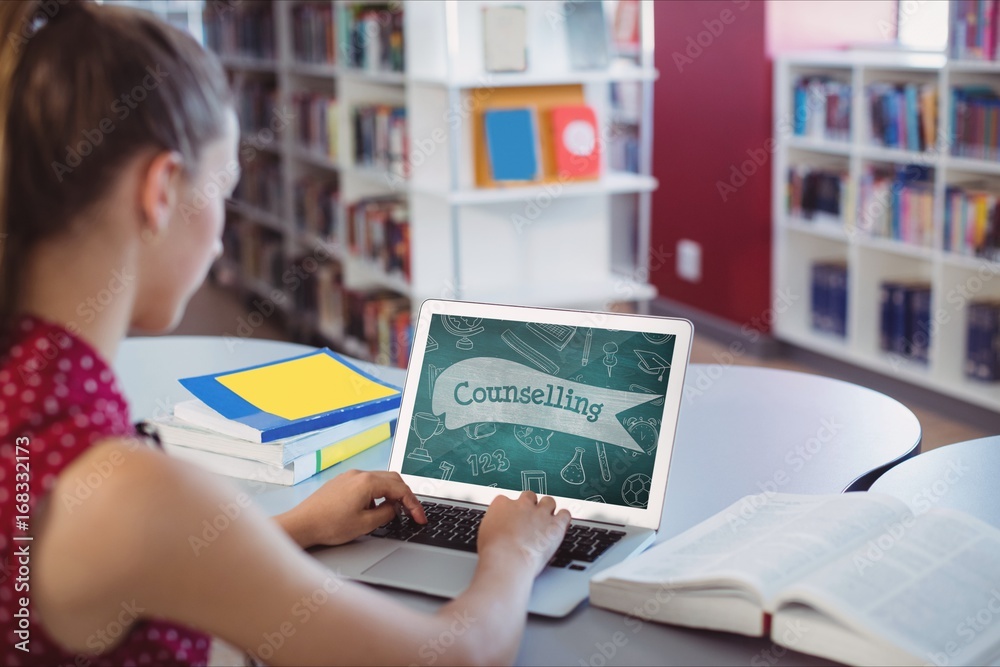 Woman using a computer with school icons on screen