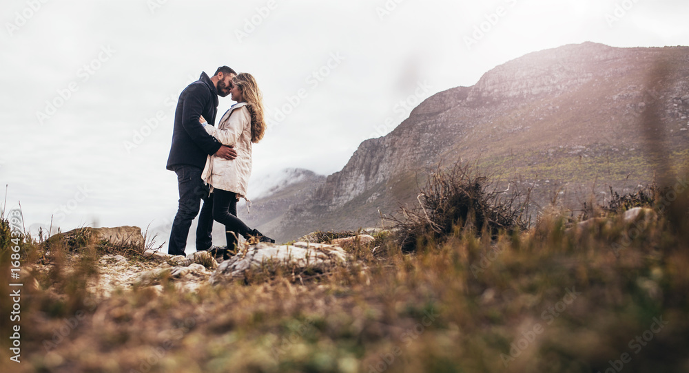 Romantic couple kissing in the nature