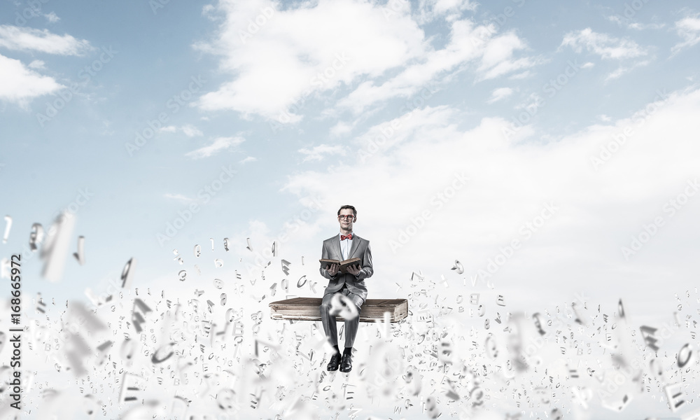 Young businessman or student studying the science and symbols fl