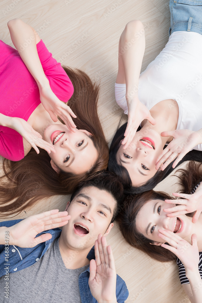 young people lying on floor