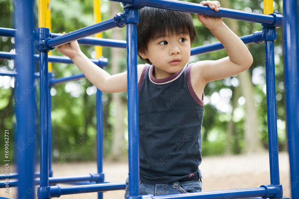 A boy playing athletic in the park