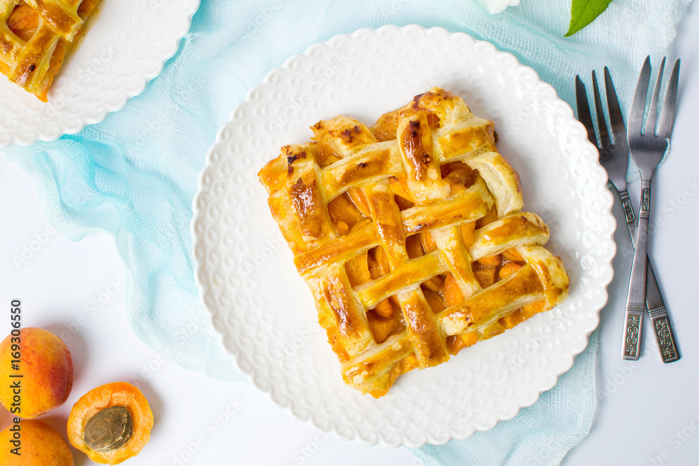 Sweet fruit pie with apricot on a plate