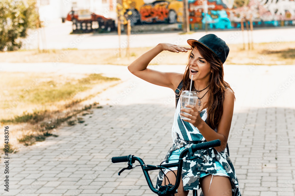 Portrait of happy young bicyclist in park