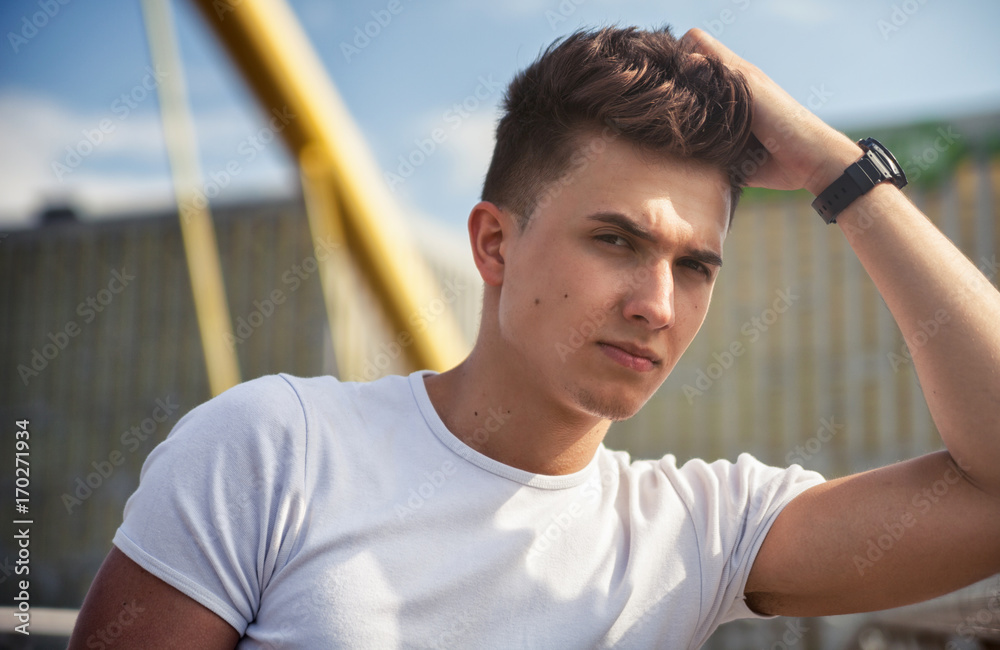 Handsome young man on walk in city