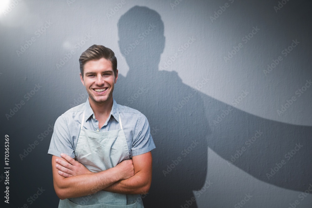 Composite image of portrait of smiling young man standing with