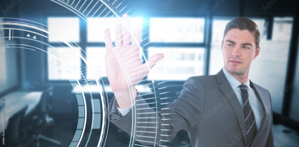 Composite image of businessman using futuristic digital screen