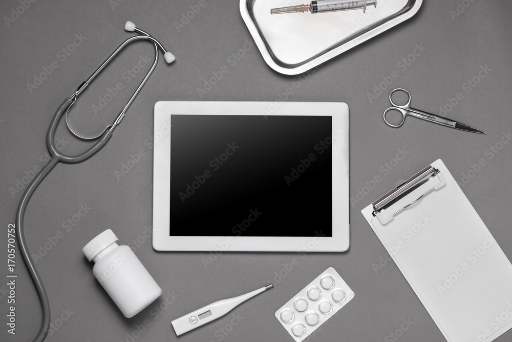 Top view of doctor desk table with stethoscope and medical items. Flat lay.