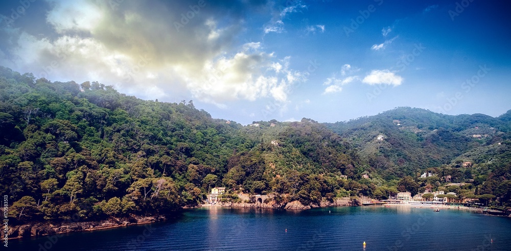 View Of Sea And Mountains Against Blue Sky