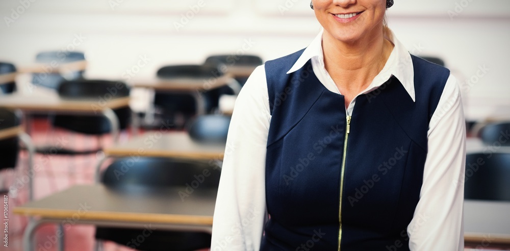 Smiling female teacher in the class room