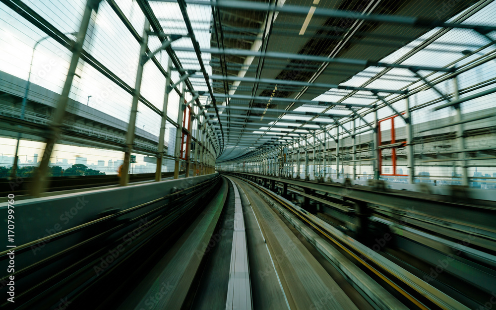 Train moving on city rail with motion blur