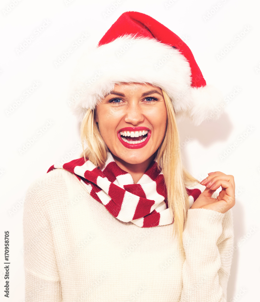  Happy young woman with Santa hat on a white background