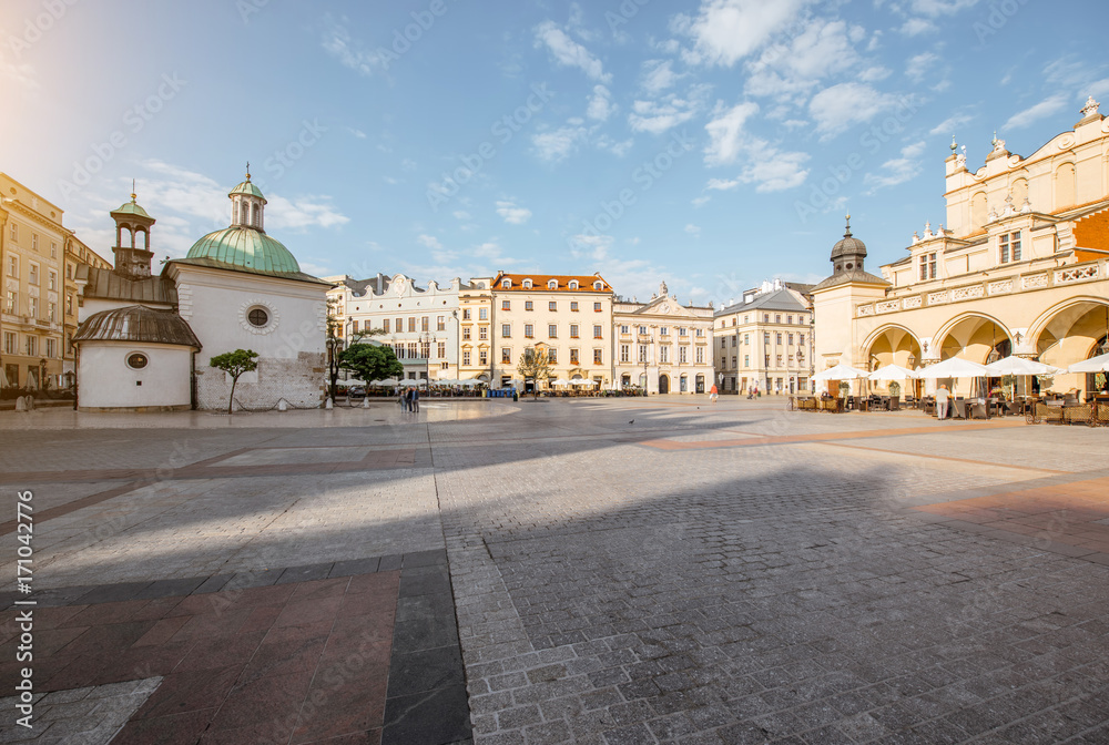 Cityscape view on the Market square with beautiful old buildings and Adalberts church during the mo