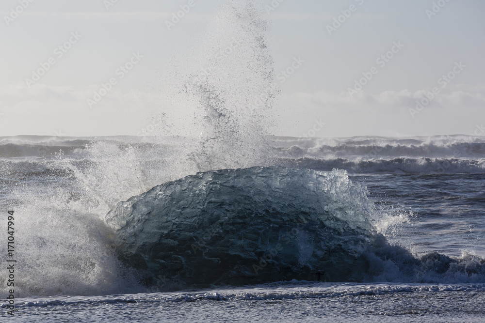 Blocks of ice from the glaciers break up and is washed ashore by the strong waves of the North Atlan