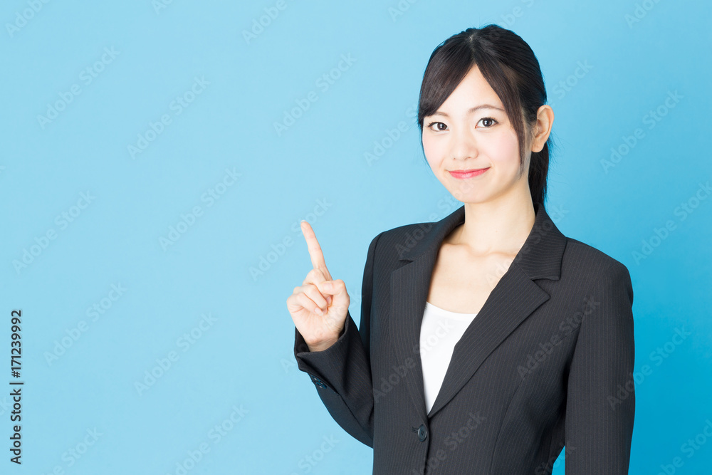 portrait of asian businesswoman isolated on blue background