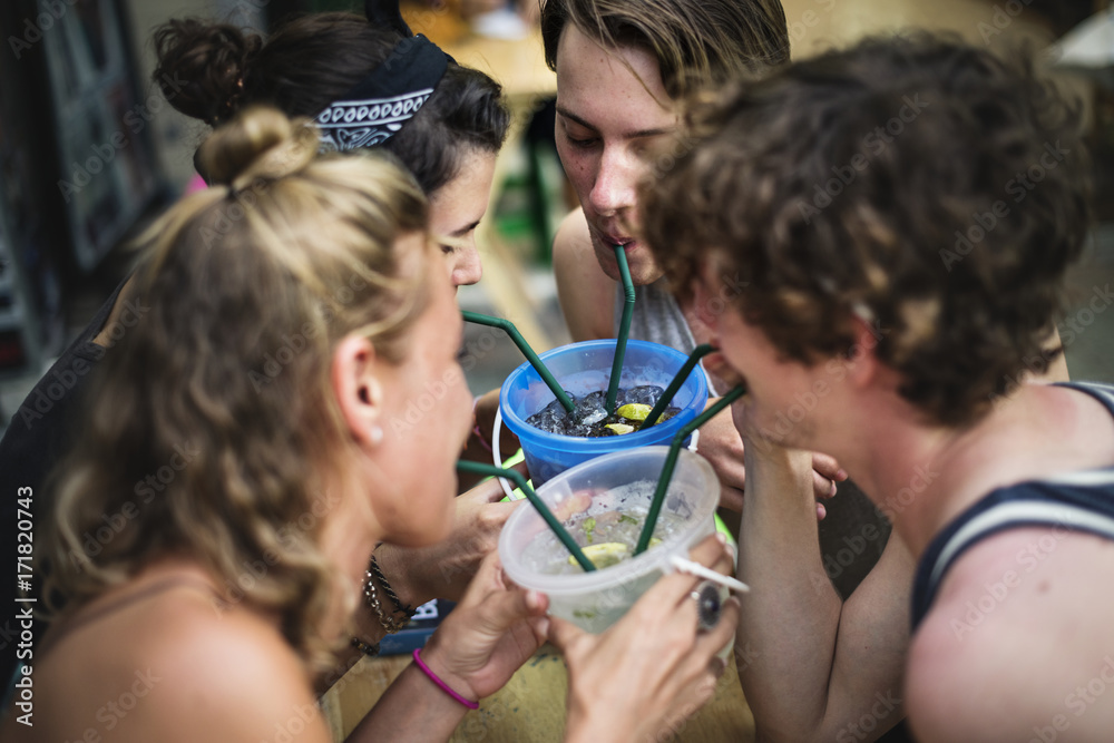 Group of tourist enjoy bucket drinks in Khao San Road Bangkok Thailand walking street