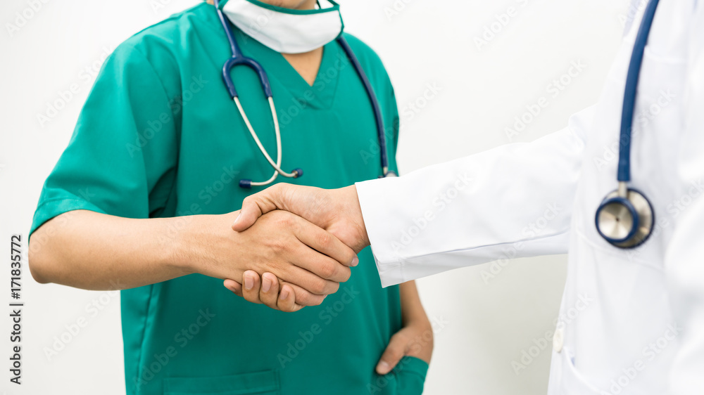 Doctors shaking hands. Medical people teamwork.