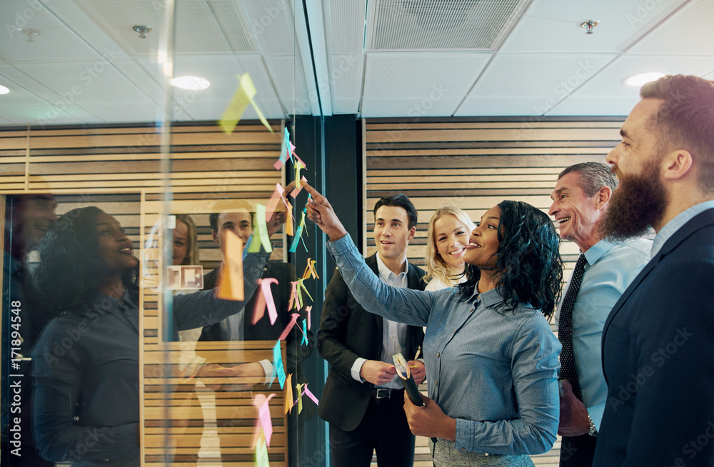 Cheerful entrepreneur team talking in the office