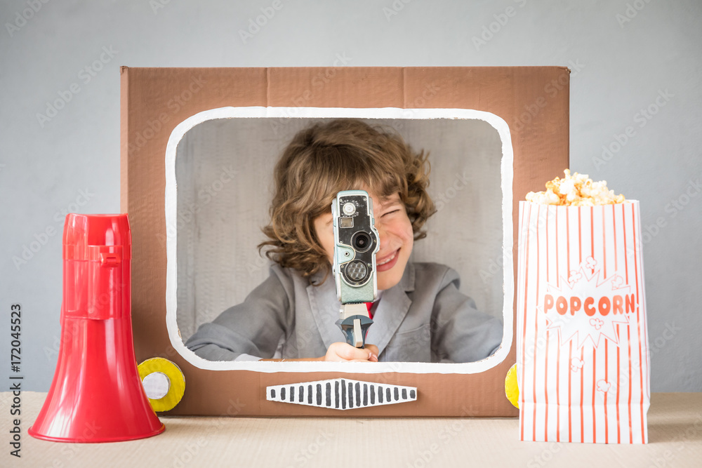 Child playing with cartoon TV