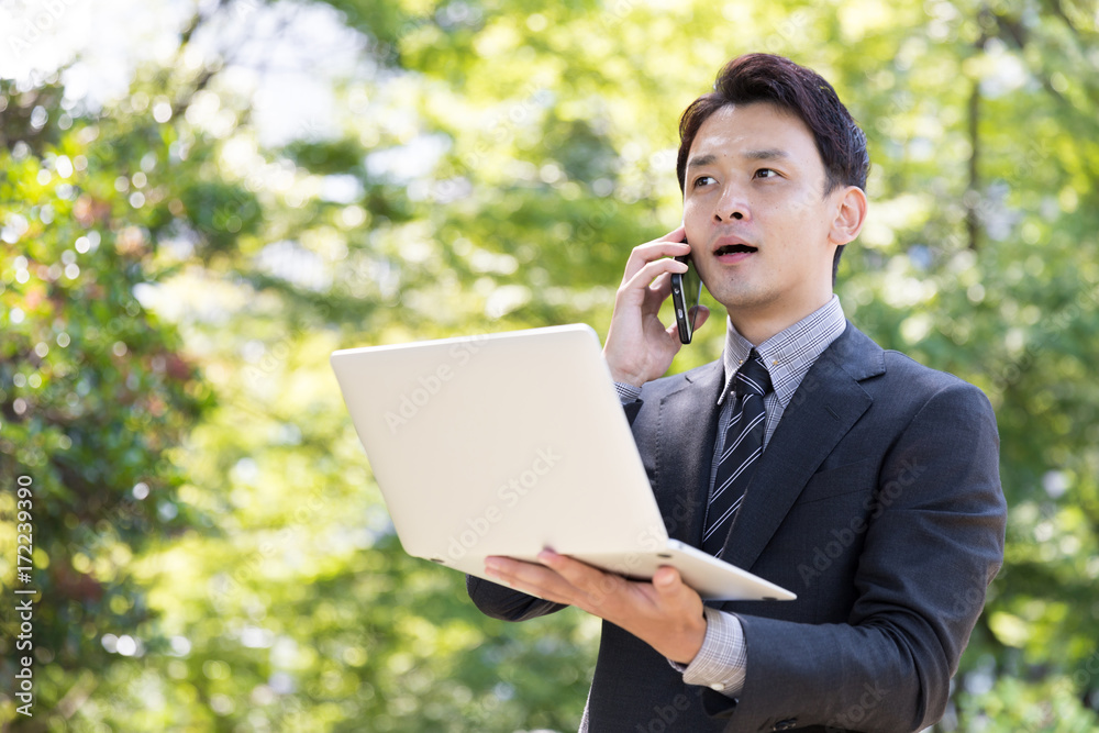 asian businessman in park