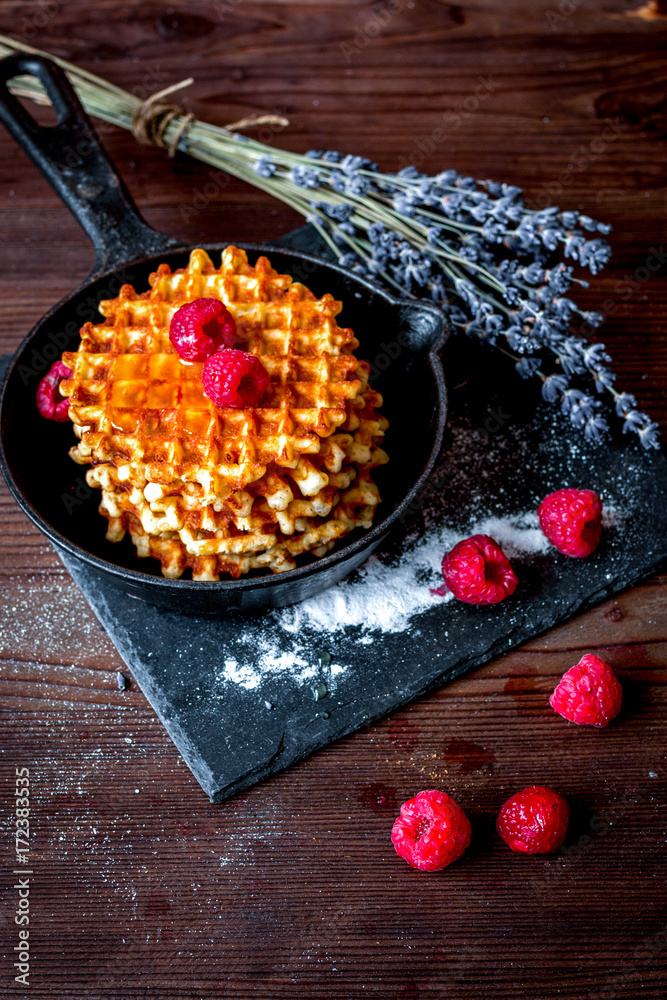 Festive composition - waffles and lavender on wooden background