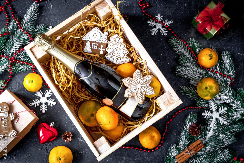 New Years champagne and tangerines in box top view