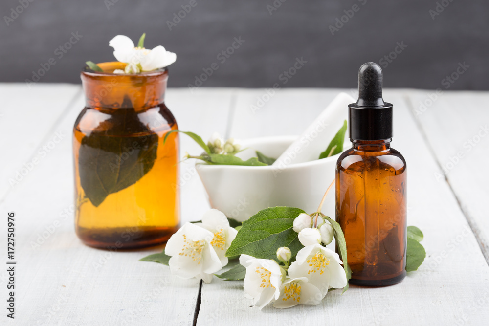 Spa concept - making essential oil with jasmine flowers