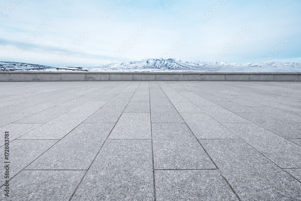 empty marble floor with beautiful snow mountains