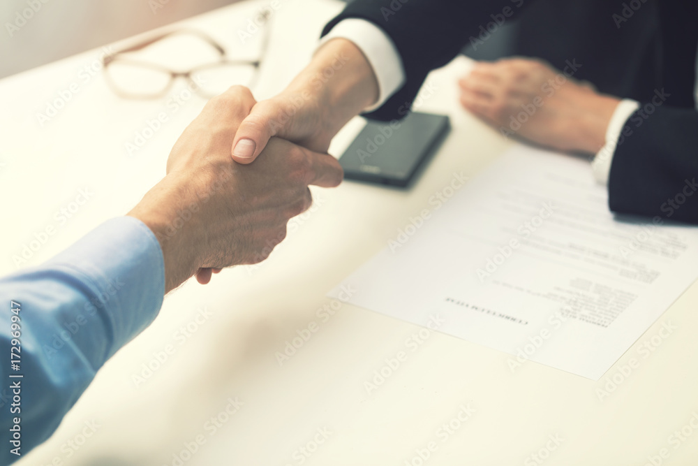 handshake after successful job interview at office