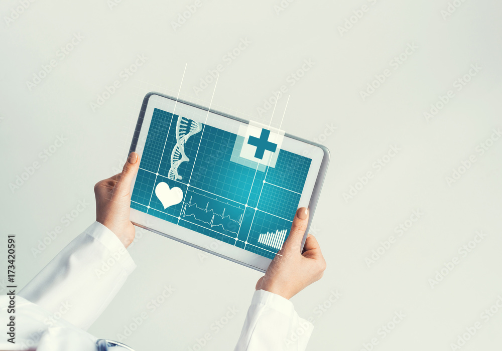 Close of female doctor hands working with tablet pc computer