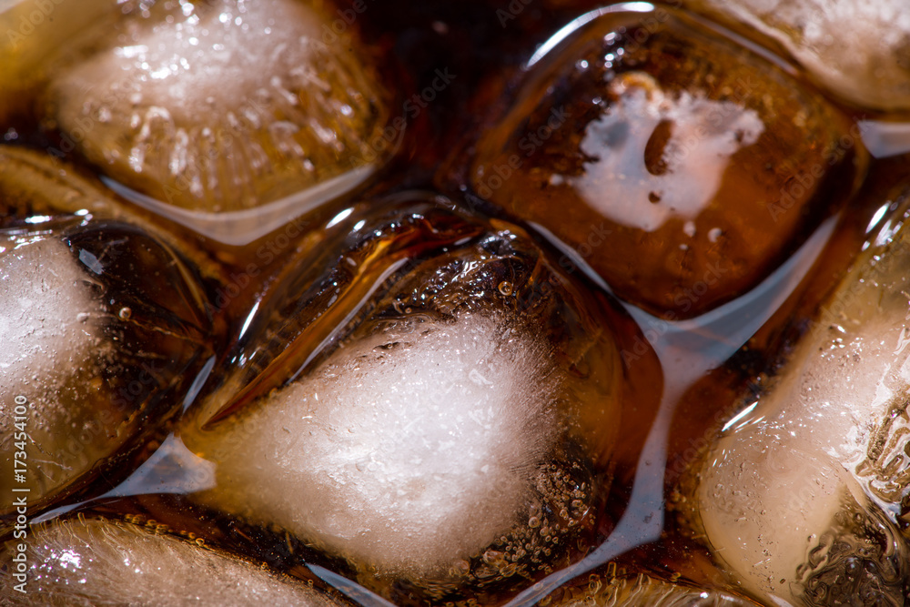 A cool glass of cola drink with ice