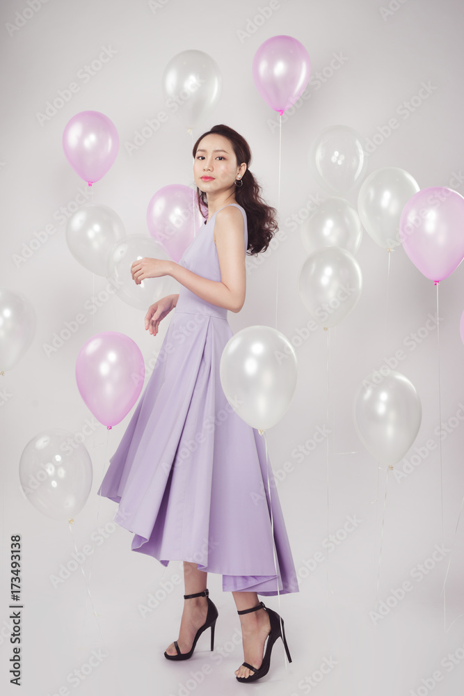 Asian pretty fashionable woman with pastel balloons