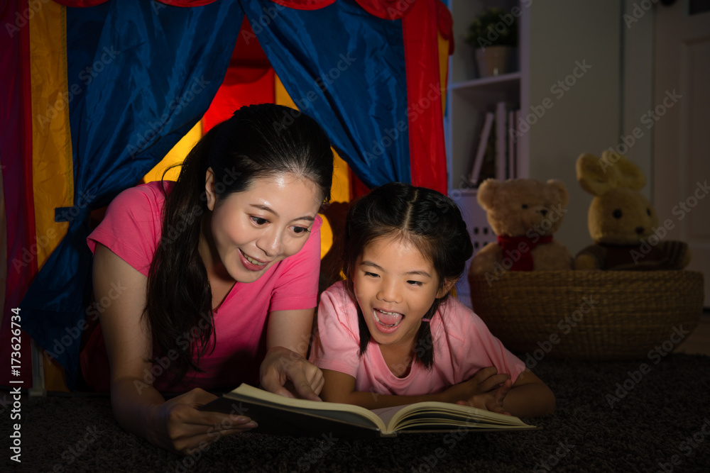 attractive elegant woman lying in children tent